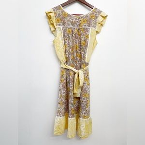 Cute 60’s inspired house dress with flutter sleeves and cinched waist.